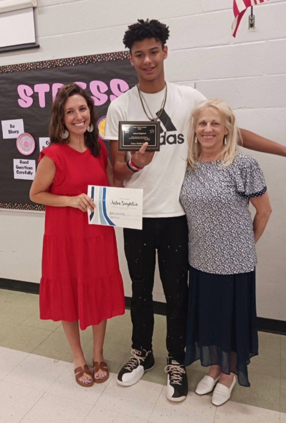 Aiden Singleton receiving the Anne Castro Award