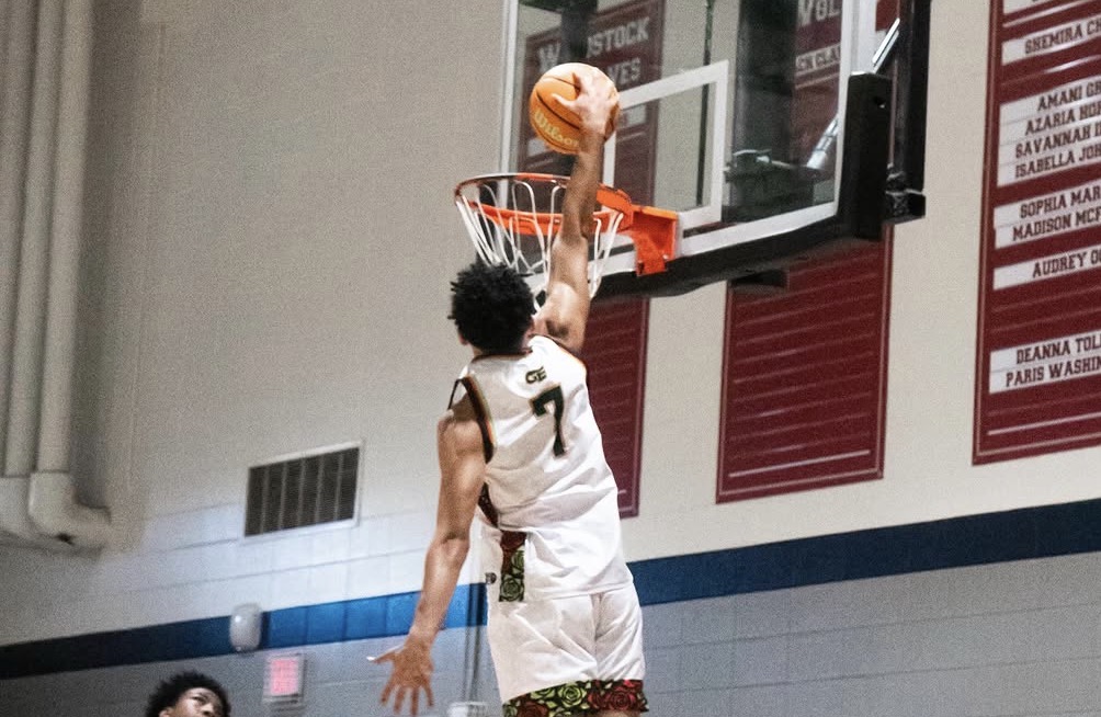 Atlanta travel basketball player dunking in GE jersey