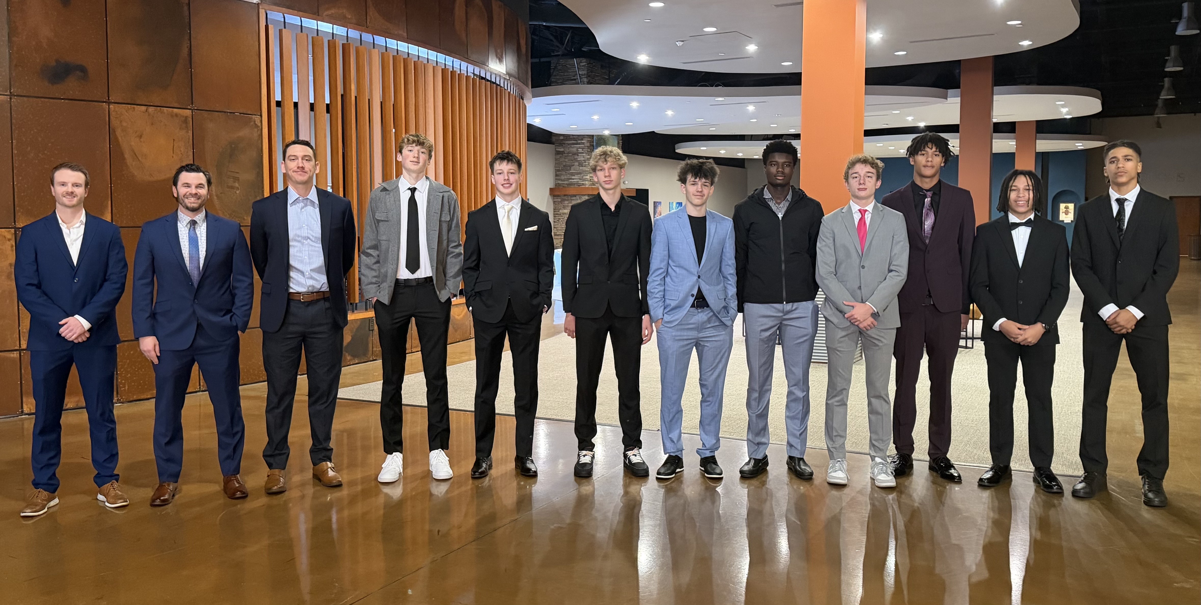 Full team and coaches lineup at College Football Hall of Fame